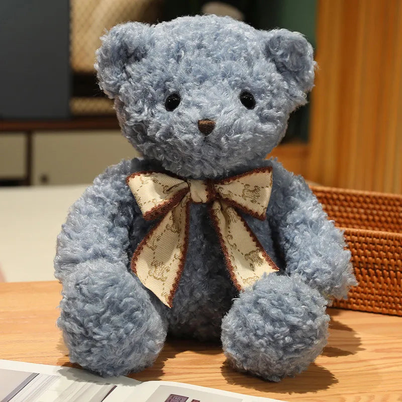 Fluffy Pink Teddy Bear with Patterned Bow